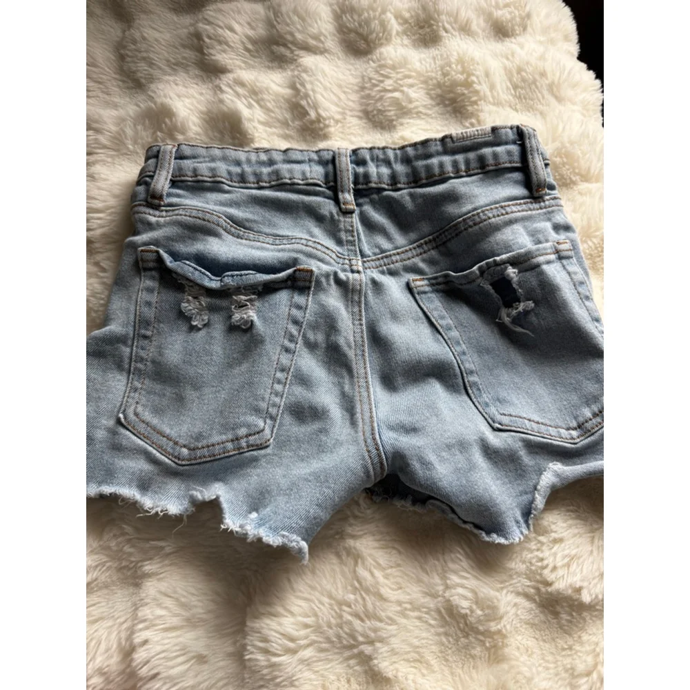 Preowned, Almost Famous light wash , distressed denim shorts, size 0